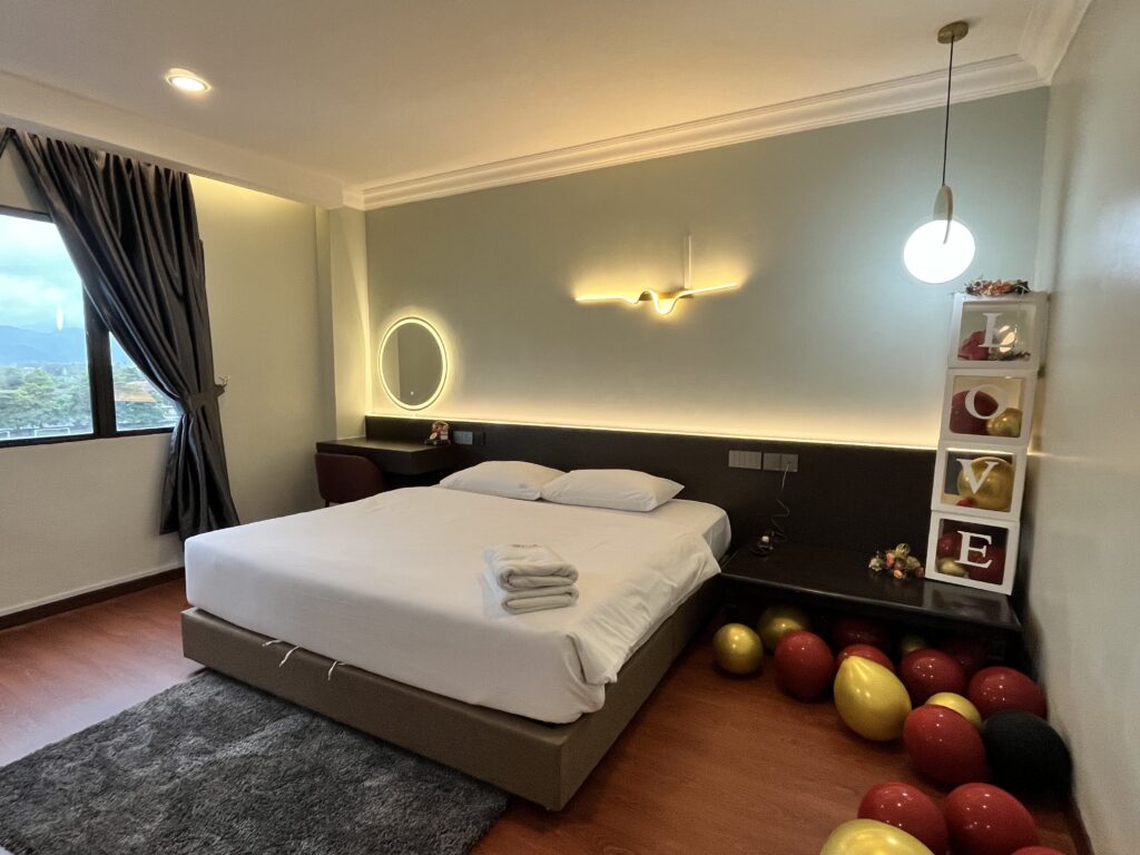 Elegant honeymoon suite with a king-size bed and romantic ambience.